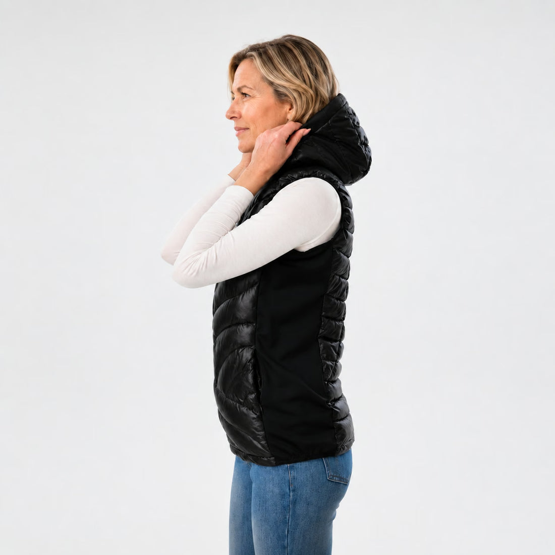 Zijkant van de Høgge² verwarmde bodywarmer met afneembare capuchon